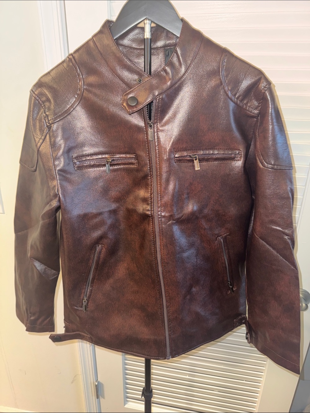 New! Dark Brown Vegan Leather jacket. With zippers on front and sides.